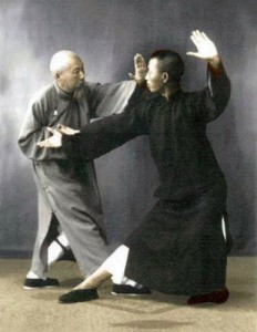 Chen Wei Ming (1881-1958) demonstrates an application of Yang style Tai Chi Chuan with his assistant Leung King Yu (1907-2003).